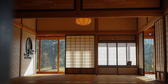 Sunlit Japanese tatami room with shoji screens and open space