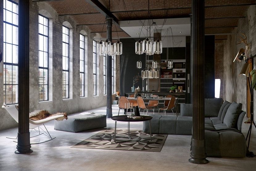 Industrial loft living room with multiple pendant lights and tall windows