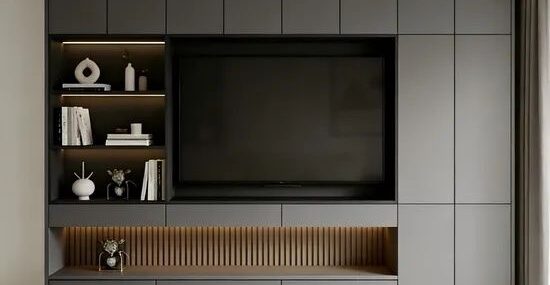 Handleless gray wall storage with a recessed television and open shelves